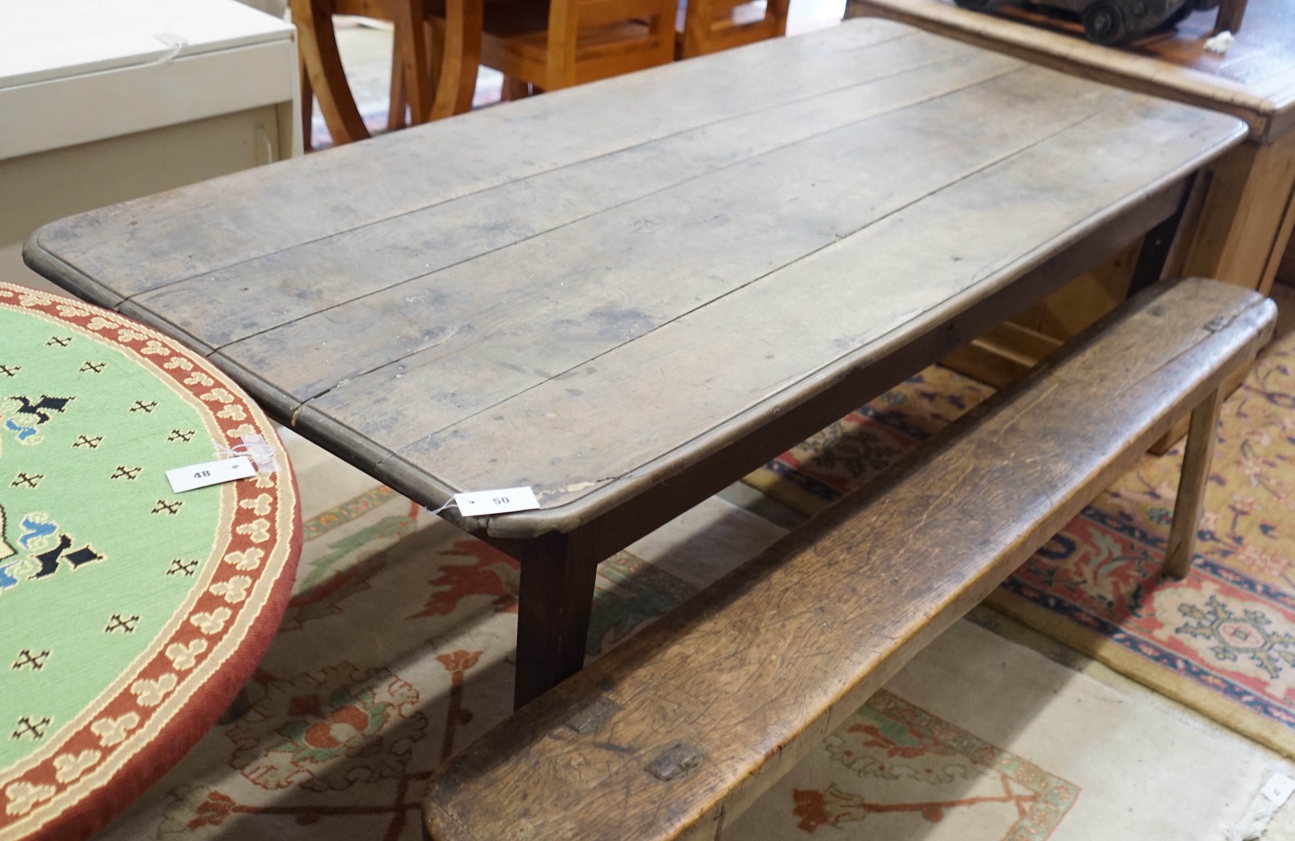 A 19th century rectangular oak kitchen table on square tapered legs, length 196cm, depth 84cm, height 74cm